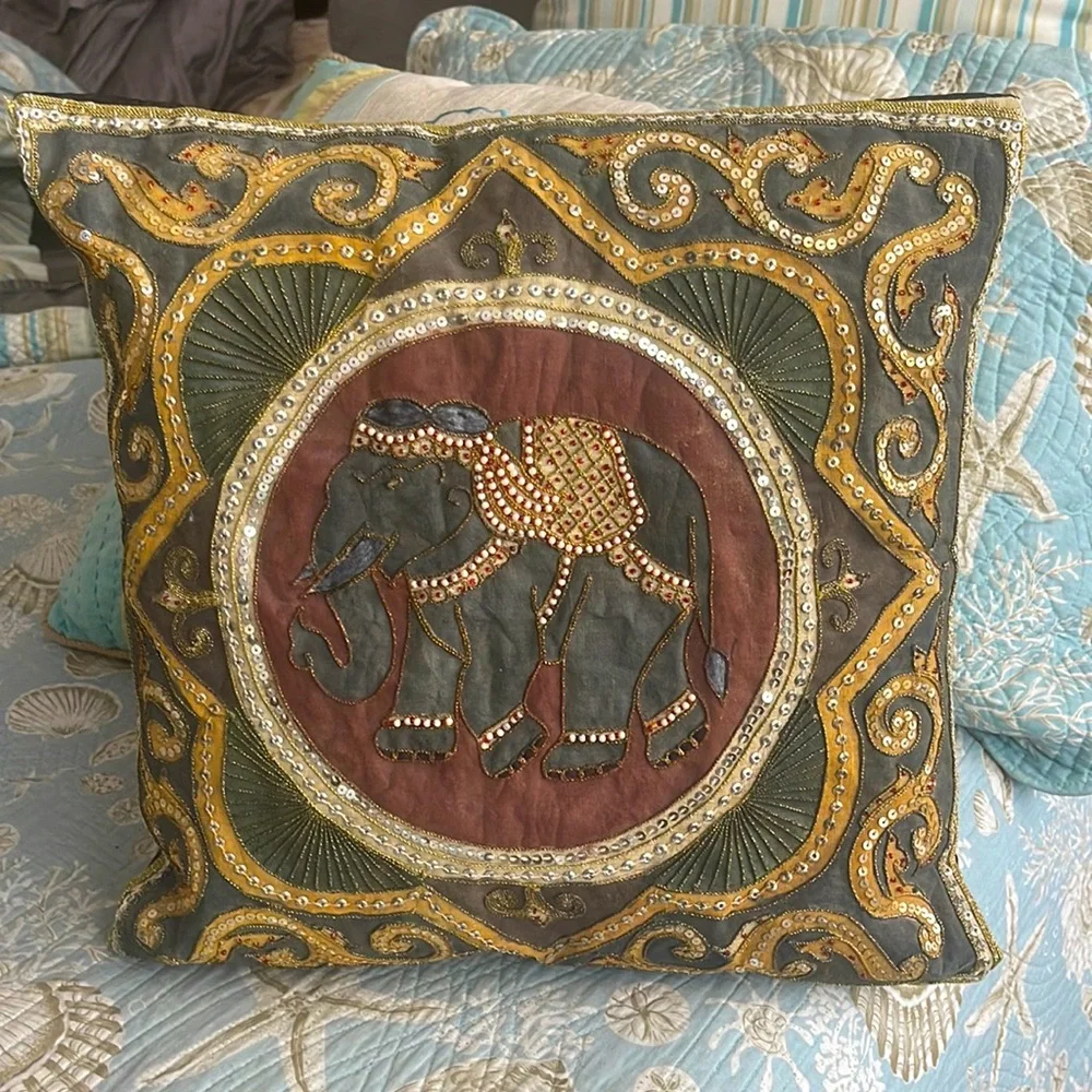 Elephant lovers this pillow is lovely exotic and quite intricate black silk back